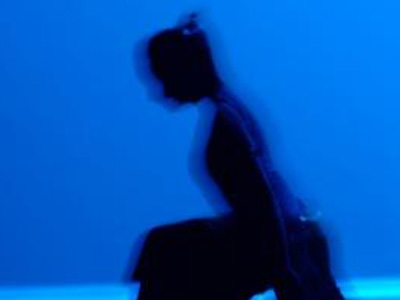 Black silhouette of a person stretching 