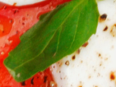 Close-up of caprese salad, made of tomatoes, basil, and mozzarella cheese