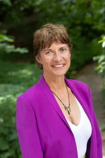 Karen Lawson smiling in a purple blazer